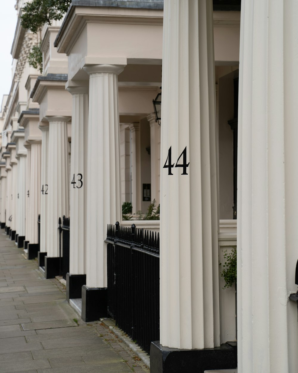 A row of white columned porticos on a London terrace